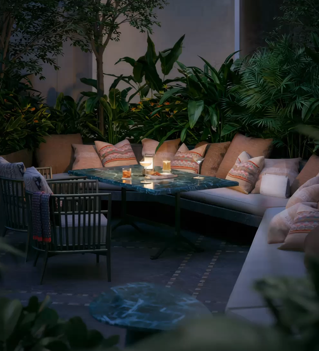 Intimate courtyard lounge glowing at dusk